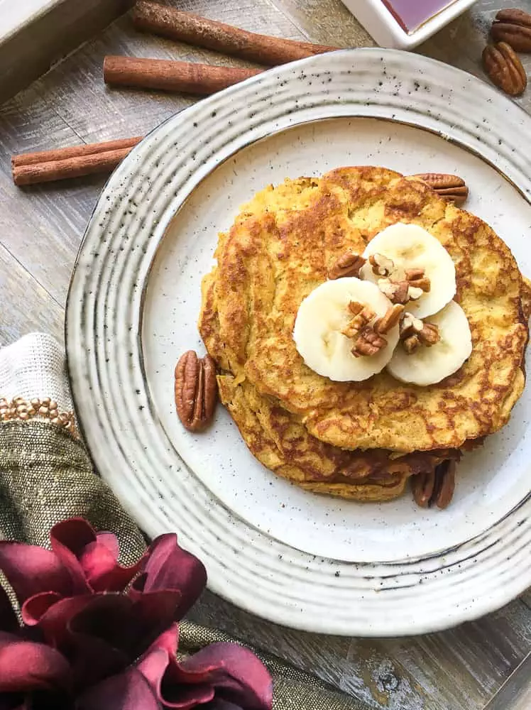 easy gluten-free pancakes topped with banana slices and nuts