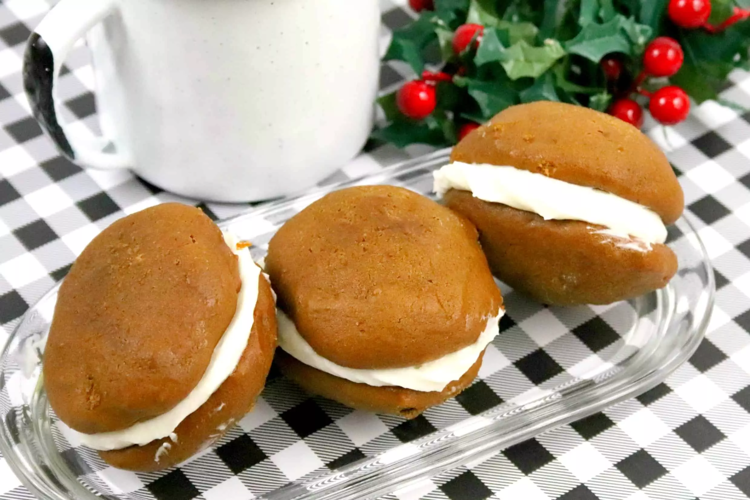 3 gingerbread whoopie pies on a dish