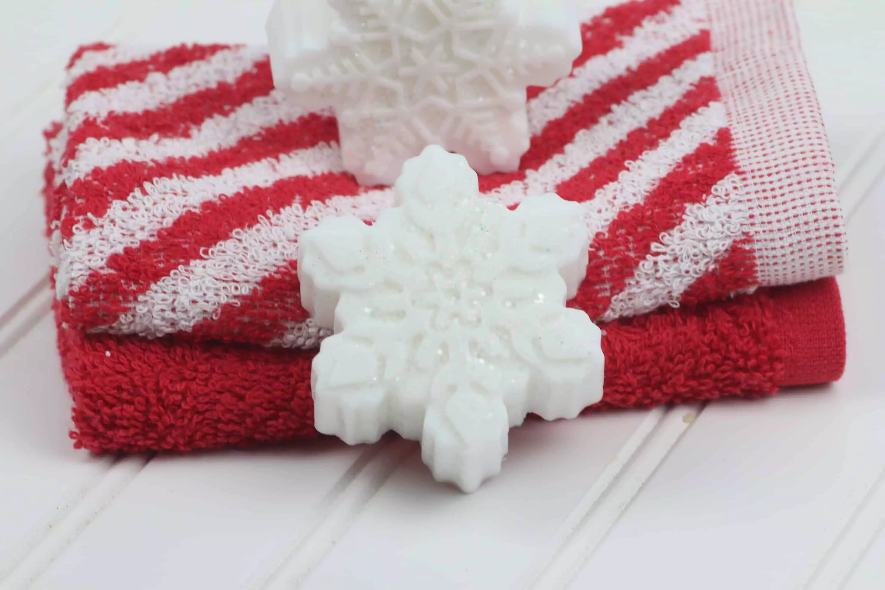 snowflake DIY soap bar on red and white towels