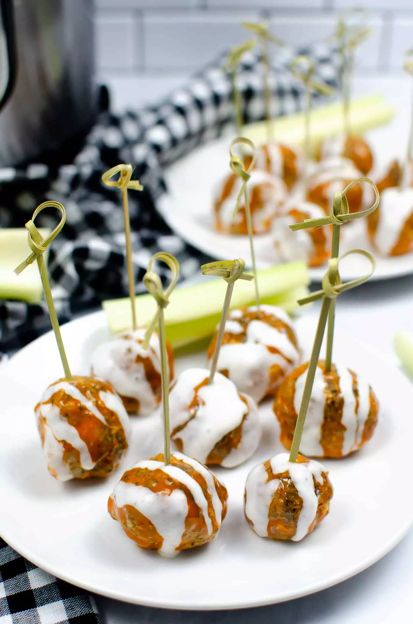buffalo chicken meatballs with toothpicks as appetizers