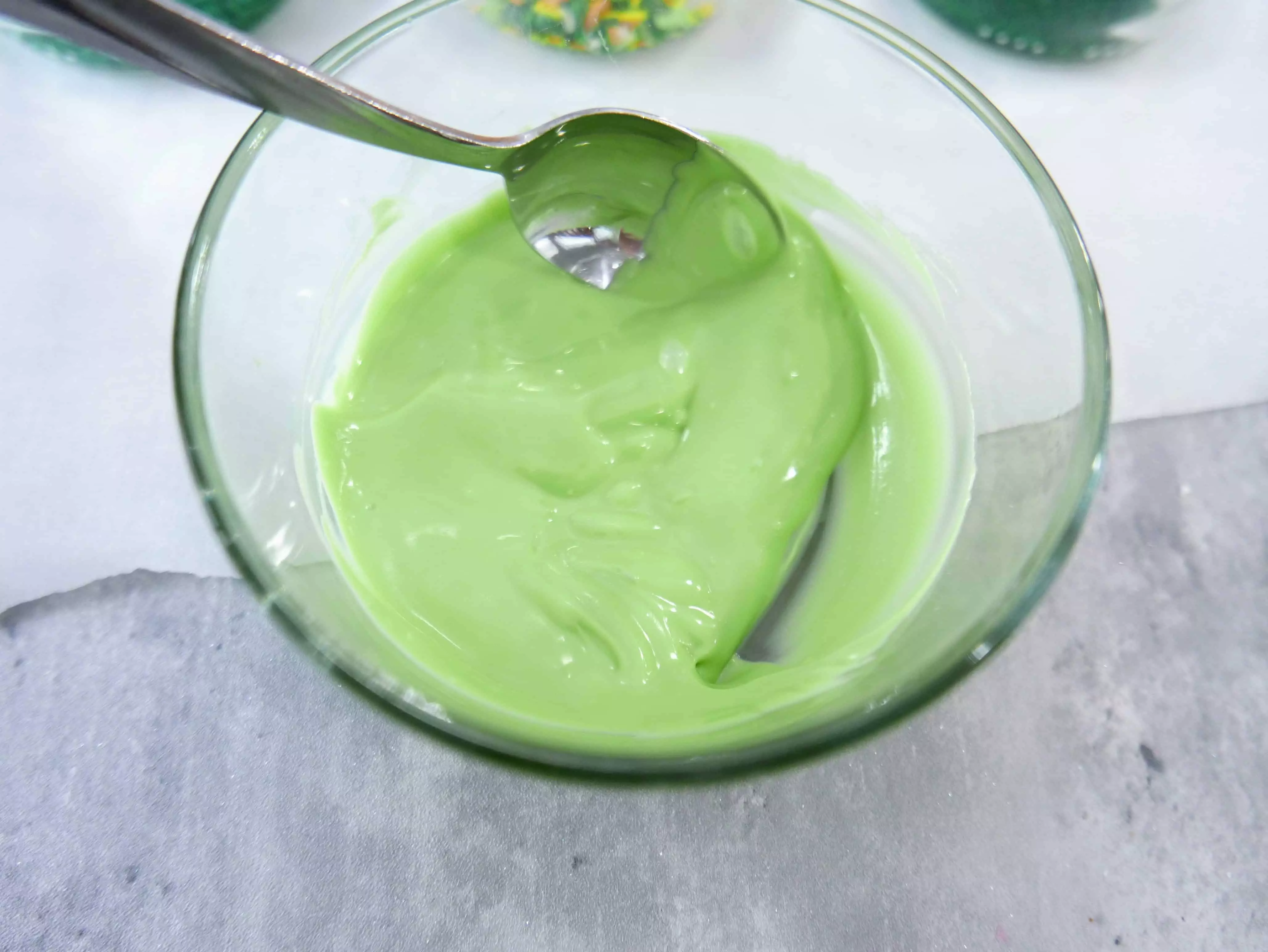 melted green candy melts in a bowl