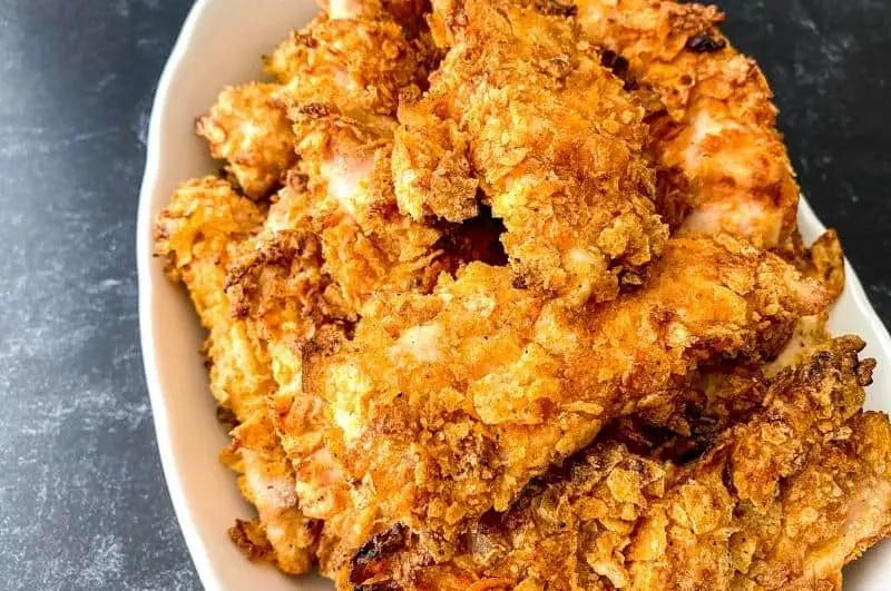 baked crispy chicken strips on a plate