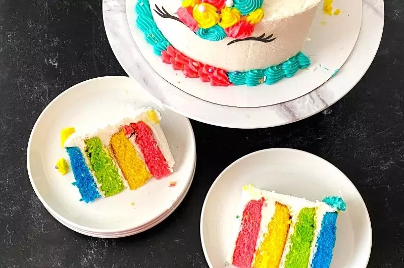 slices of rainbow layered cake from above