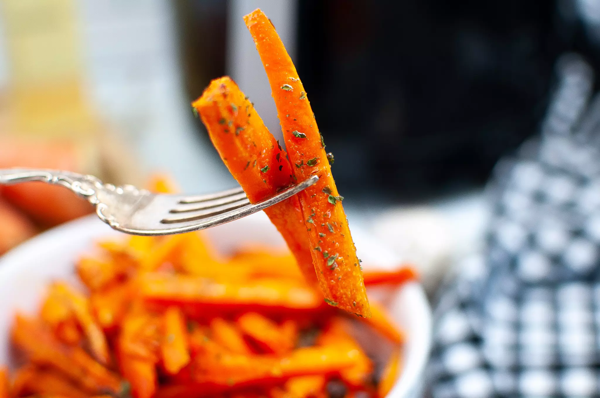air fryer carrot fries on a fork