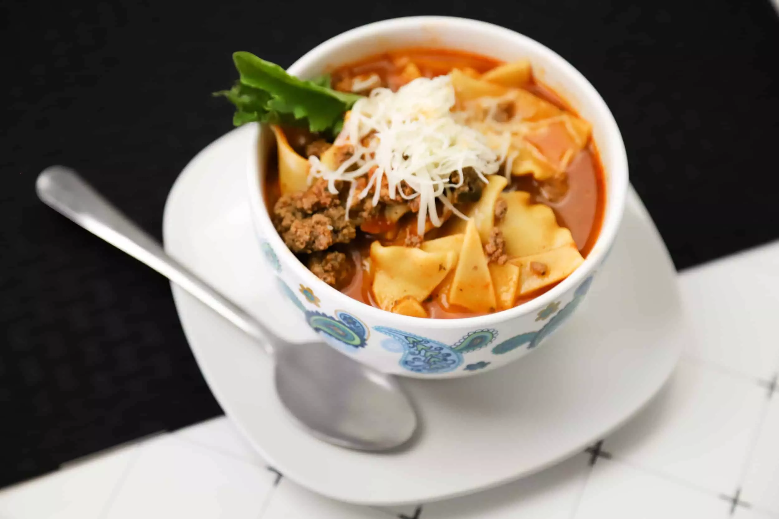 Instant pot lasagna soup in a bowl with a spoon
