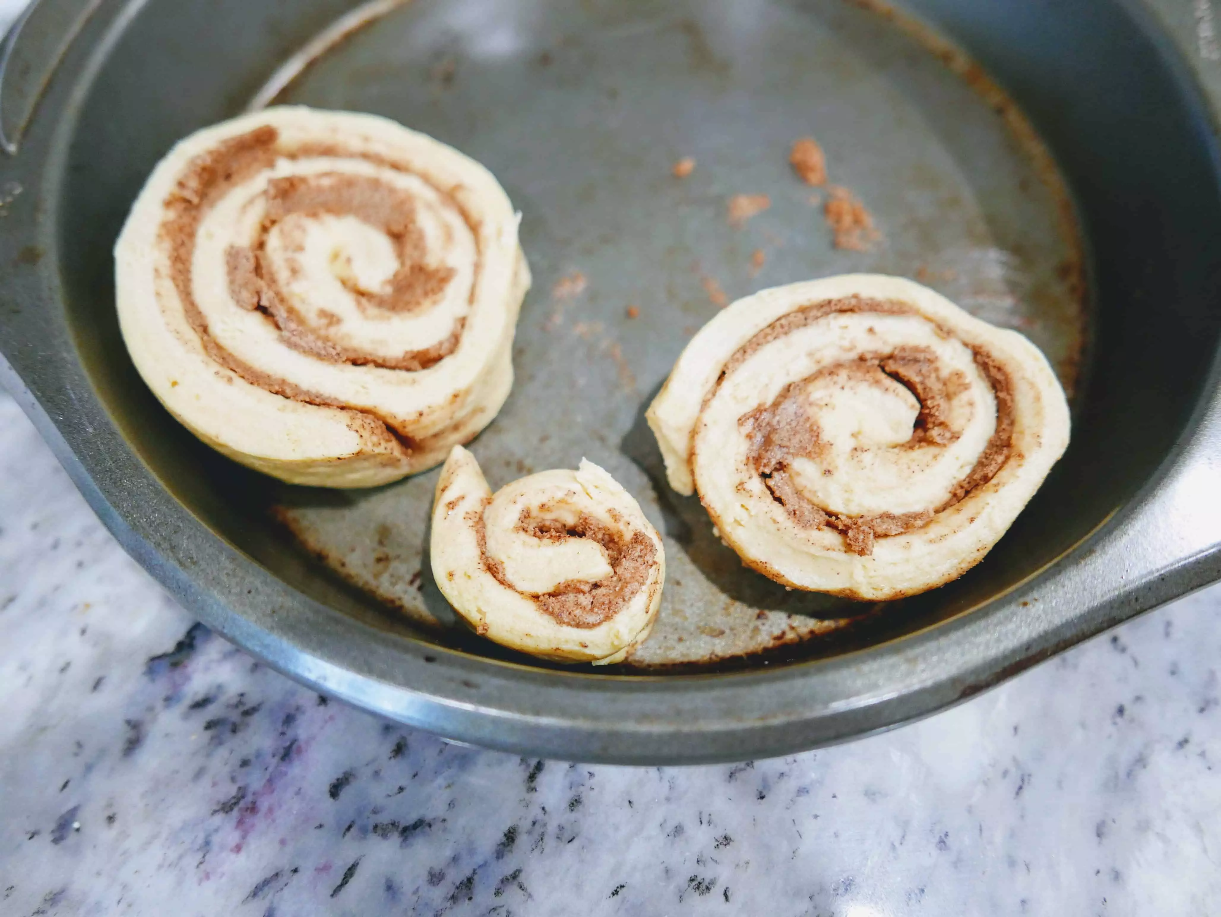 cinnamon rolls in pan to cook