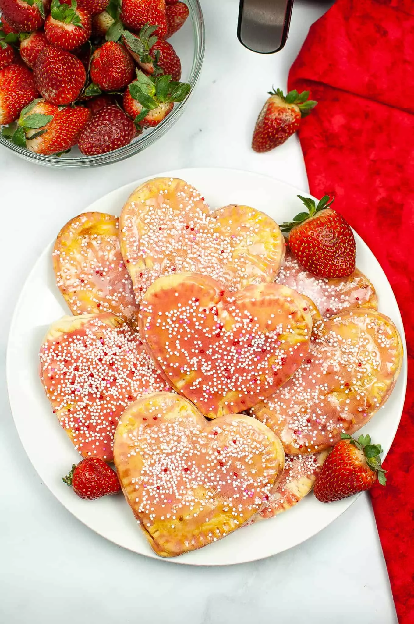 plate of heart-shaped homemade strawberry pop tarts