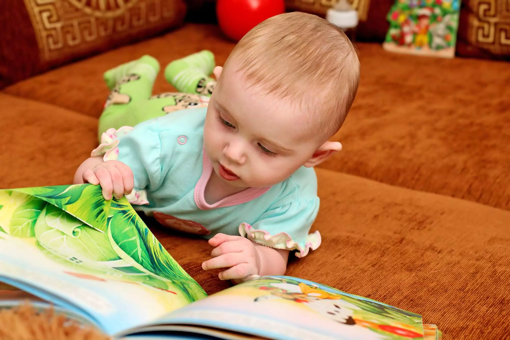 baby reading book milestones