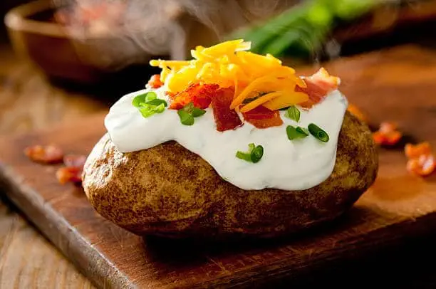 Baked potatoes taste just as good when cooked in the slow cooker! Get this recipe and more at Made in a Pinch. To get recipes and helpful tips follow us on Pinterest!