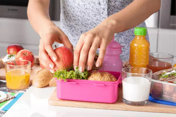 Mom packing healthy school lunch