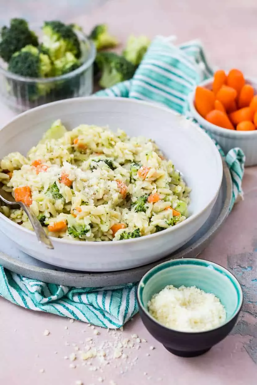 this carrot, broccoli, and cheese orzo is just one of 100+ kitchen staples recipes your family will love