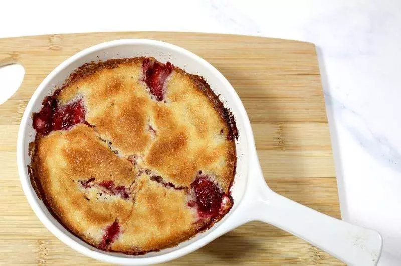 strawberry cobbler in baking dish