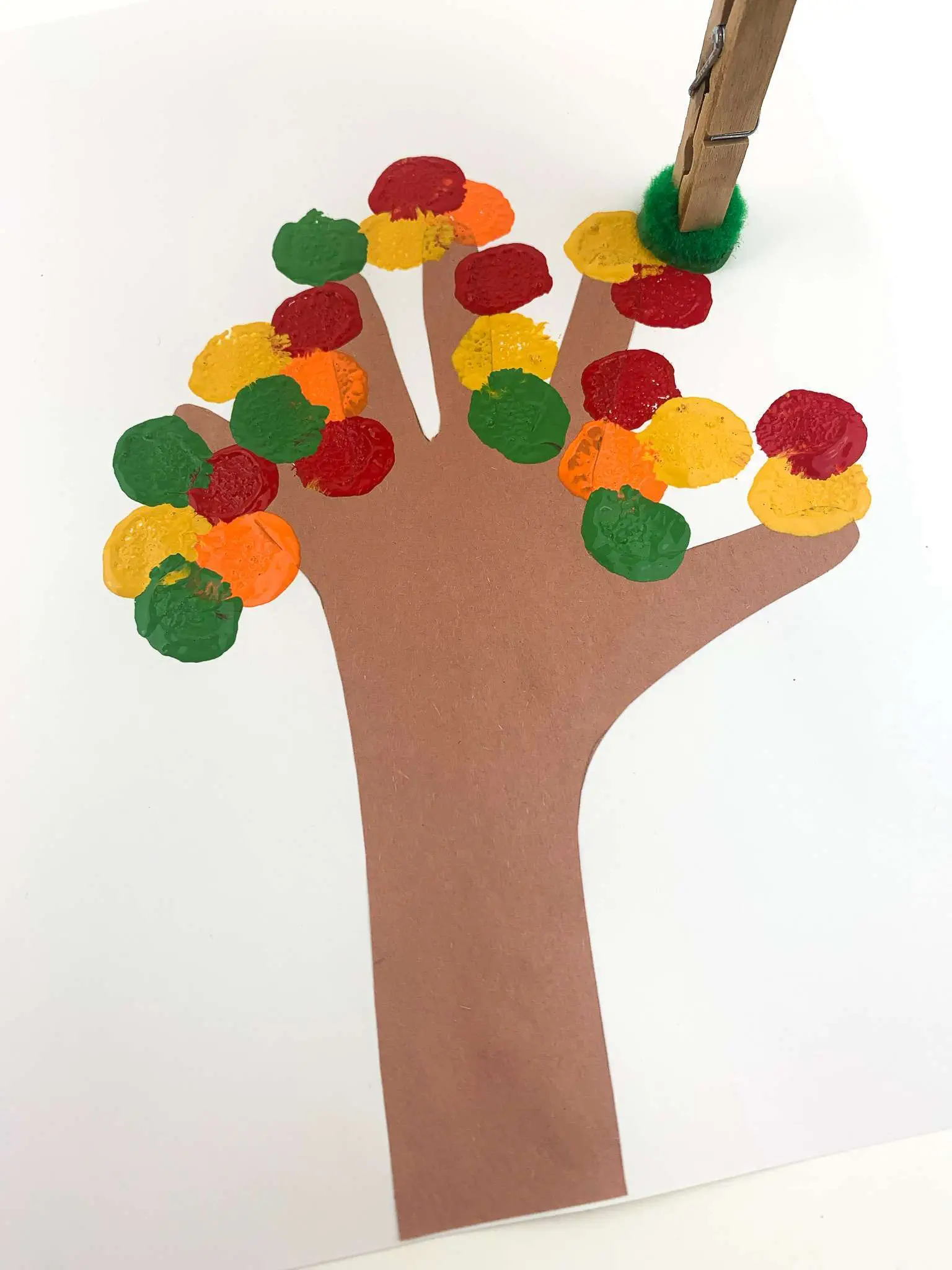 adding paint with pom pom