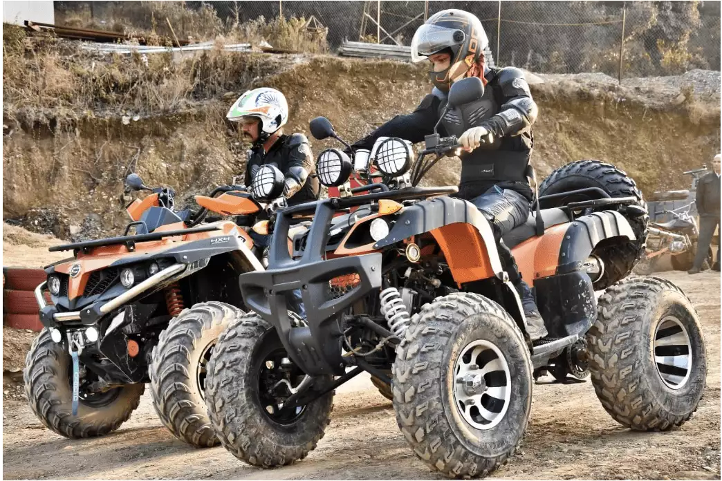 People riding ATVs safely