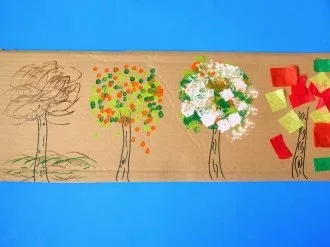 four seasons tree craft for kids using 4 different methods for painting on the leaves.