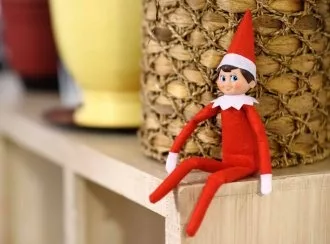 Holiday figure sitting on a shelf