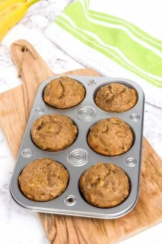 baked banana protein muffins in muffin tin