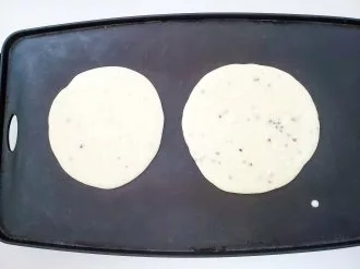 pancake batter on griddle